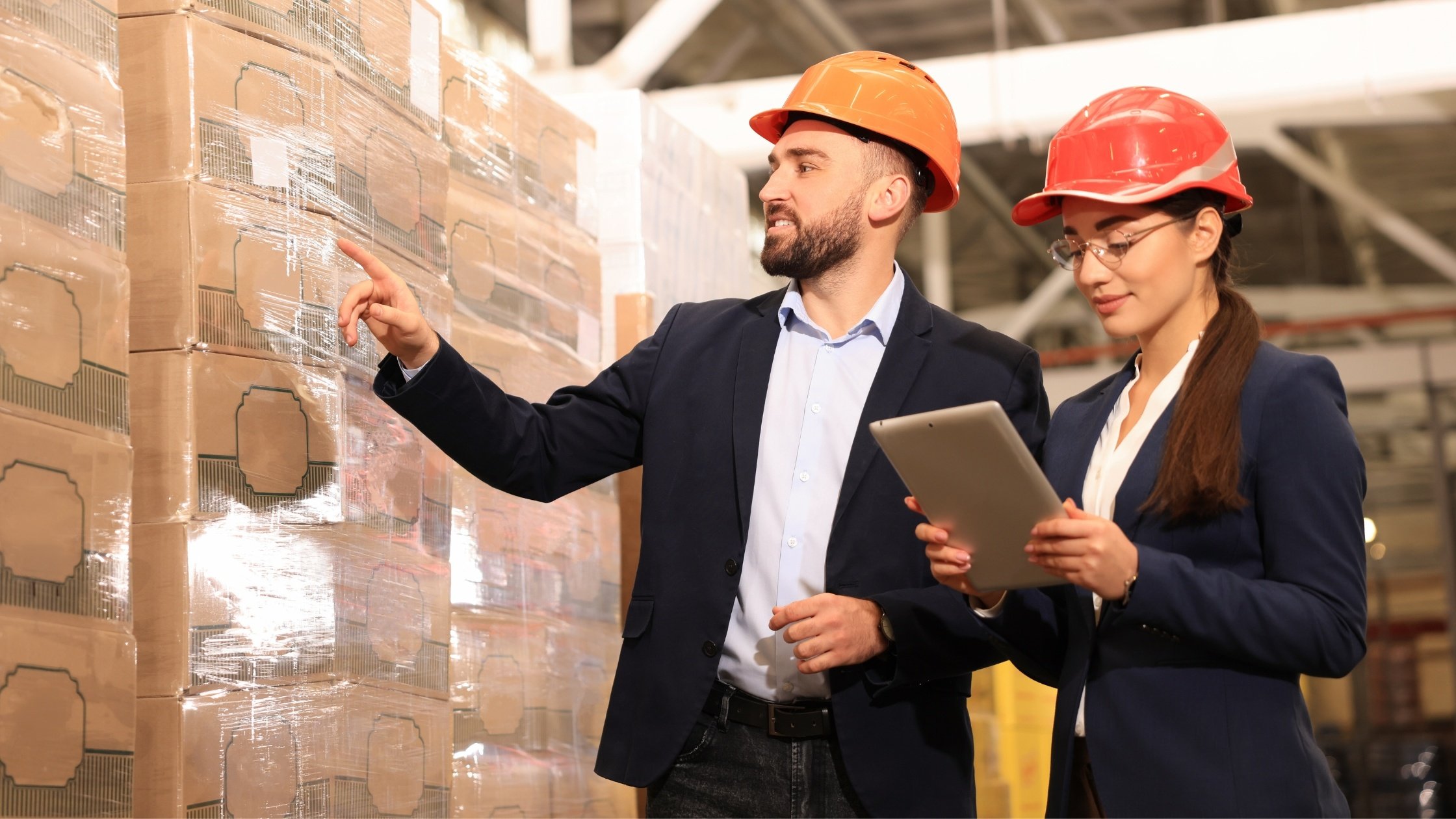  Two People with a Tablet COunting Inventory 
